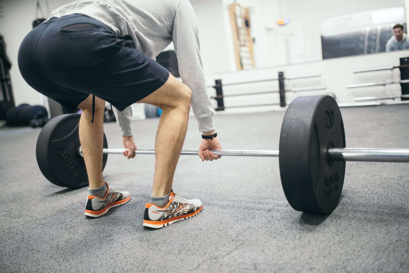 Start position of a conventional barbell deadlift, double-overhand grip.