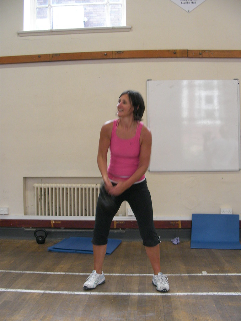 Two-hand kettlebell swing at the hinge/bottom.