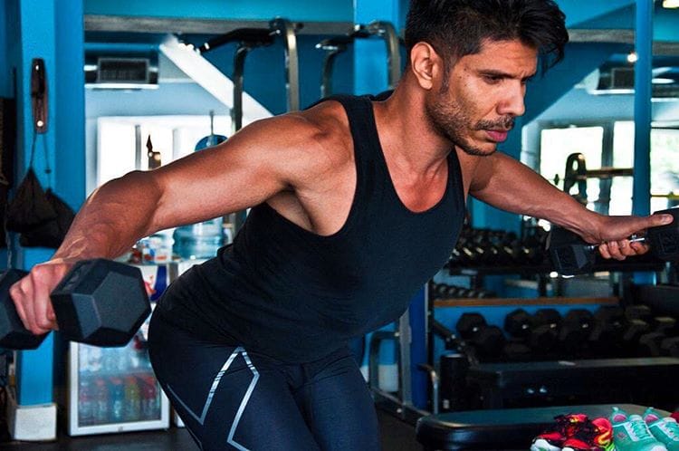 Bent-over dumbbell reverse fly at mid-range.